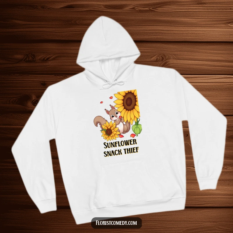 Funny squirrel hoodie featuring a curious squirrel picking petals from a sunflower, perfect for cozy days and embracing funny nature vibes.