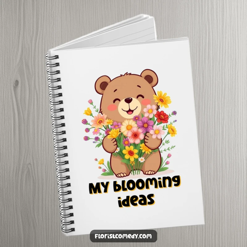Funny bear notebook with a happy bear arranging a bouquet of wildflowers, ideal for creative notes and nature journaling.