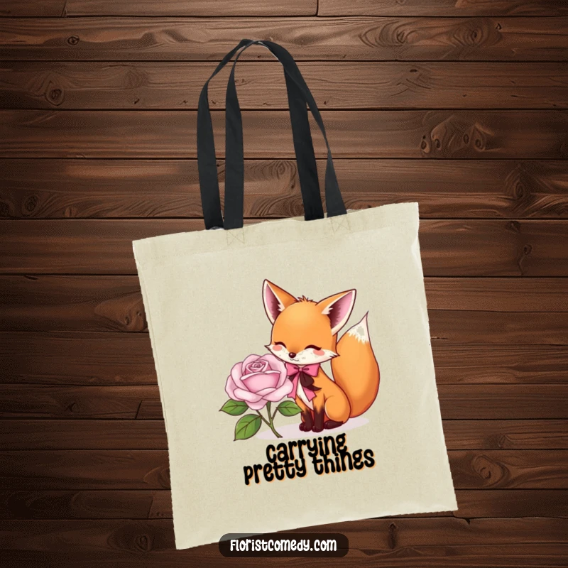 Funny fox tote bag showing a playful fox tying a ribbon around a rose, a humorous and stylish accessory for flower enthusiasts.
